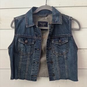 Abercrombie & Fitch Blue Denim Vest, cropped and has raw hem. Great condition